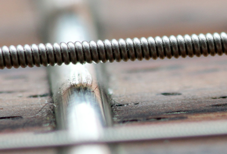 Fretboard A-string in extreme closeup